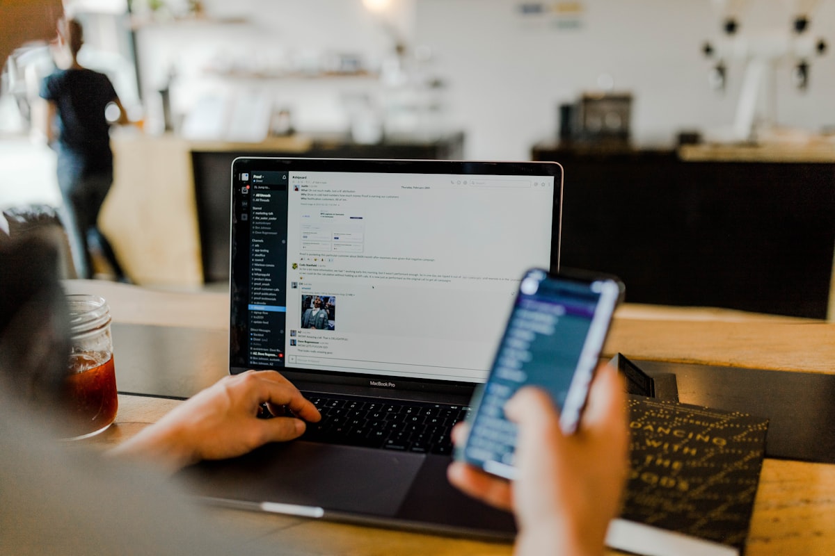 Person receiving remote IT help on a laptop